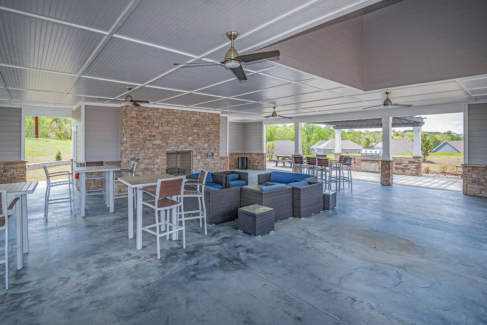 Outdoor seating arranged on a stained and sealed concrete patio floor